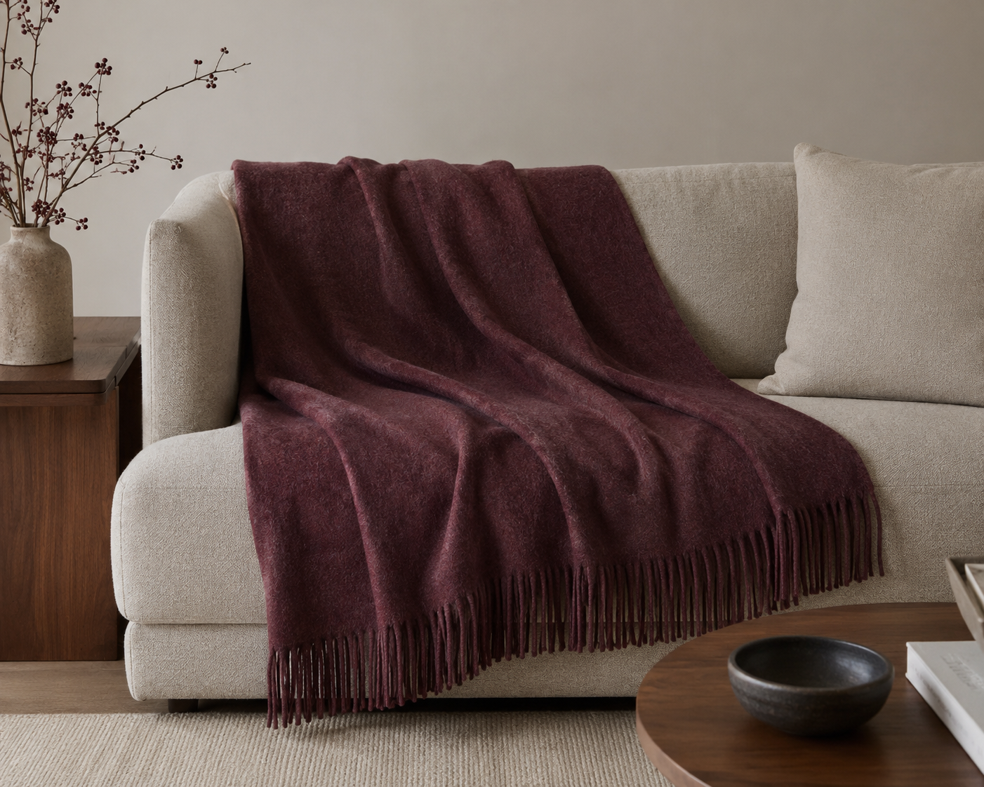 The same selected throw styled across a structured living room sofa