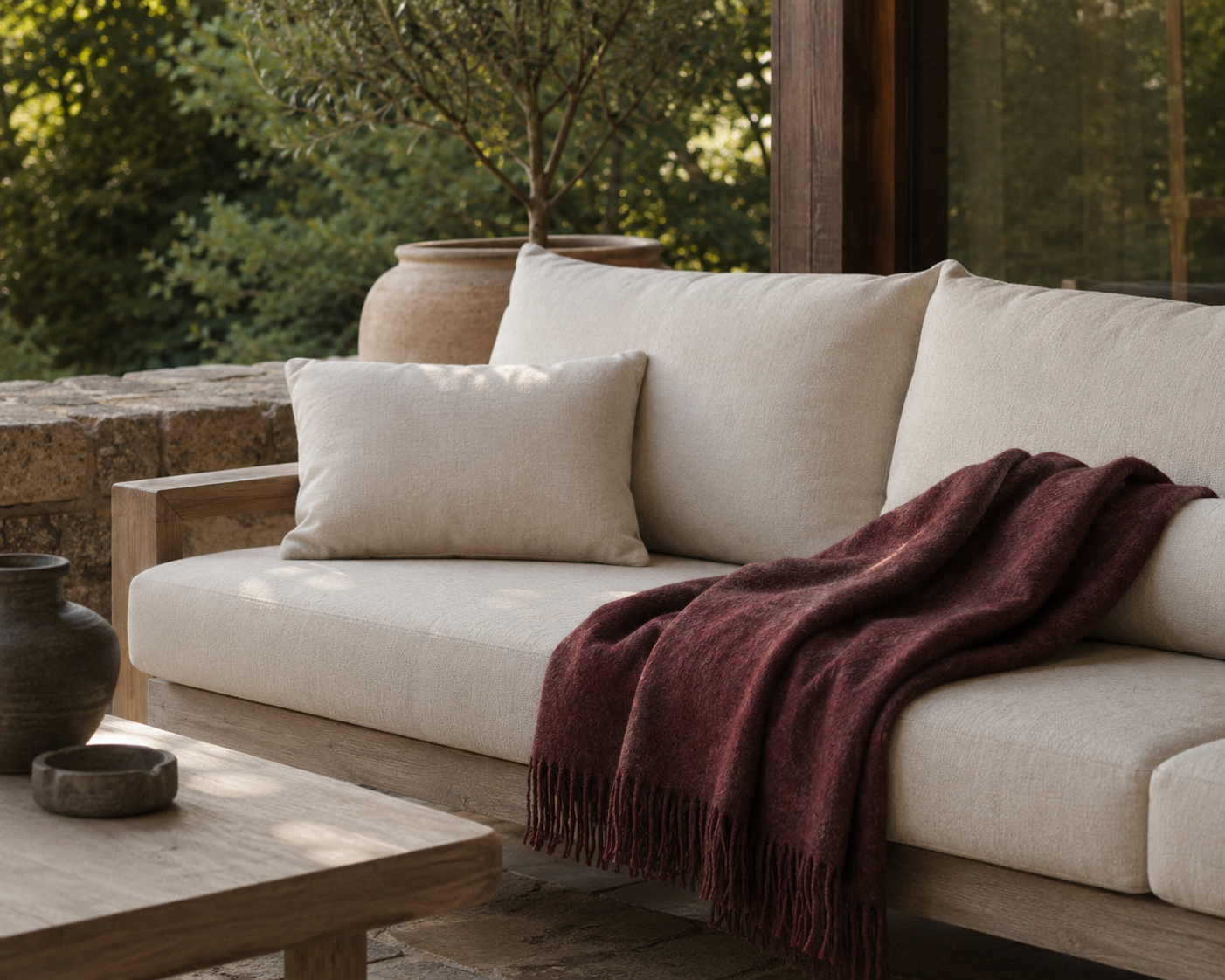 The same selected throw placed on an armchair in a quiet reading corner